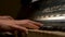 A young woman playing piano closeup. Piano hands pianist playing Musical instruments details with player hand closeup