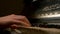 A young woman playing piano closeup. Piano hands pianist playing Musical instruments details with player hand closeup