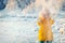 Young Woman playing with snow Outdoor Winter Lifestyle