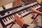 Young woman playing synthesizer in studio