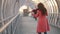 Young woman playing violin solo composition in the street