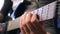 A young woman plays the guitar. Girl practicing guitar while staying at home