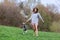 Young woman plays with her Dalmatian dog