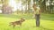 Young woman plays with his beagle Dog friend