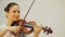 Young woman plays violin