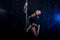 Young woman pole dancer. Water studio photo