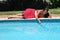 Young woman at poolside