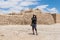 Young woman posing against the backdrop of the fortress walls of the city of Nabataean city Avdat, located on the incense road to