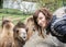 Young woman posing with camel