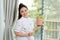 Young woman with potted plants on a garden balcony. Floriculture is a hobby