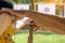 Young woman practice archery with male instructor closely supervising. Young female archer, young female archer, archery, shoot