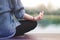 Young Woman Practices Yoga in Outdoor. Sitting in Lotus Position. Unplugged Life and Mental Health Concept