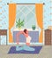 Young woman practices yoga or Pilates at home. Relaxation and self-improvement, stay at home