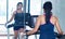 Young woman practicing in the gym with mirrors.