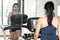 Young woman practicing in the gym with mirrors.