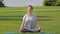 Young woman practicing meditation outdoors