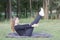 Young woman practicing pilates in nature