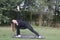 Young woman practicing pilates in nature