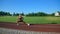 Young woman practicing side lunges at stadium.