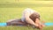 Young woman practicing stretching yoga exercise in nature