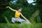 Young Woman practicing tai chi chuan in nature.