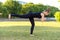 Young woman practicing vajra yoga in city park