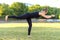 Young woman practicing vajra yoga in city park