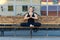 Young woman practicing vajra yoga sitting on bench