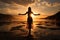 A young woman practicing yoga on the beach at sunset