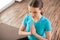 Young woman practicing yoga at home