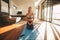 Young woman practicing yoga indoors, Vajrasana.