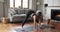 Young woman practicing yoga, standing in Extended Triangle Pose