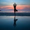 Young woman practicing yoga at sunset on the coast