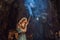 Young woman praying in a Buddhist temple holding incense Huyen Khong Cave with shrines, Marble mountains, Vietnam