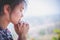 Young woman praying with  hand,  prayer concept for faith, spirituality and religion