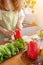 A young woman prepares bell peppers for her breakfast and is ready for a healthy meal on the table with healthy, organic