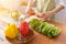 A young woman prepares bell peppers for her breakfast and is ready for a healthy meal on the table with healthy, organic