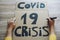 Young woman preparing a banner for Covid 19 economic crisis protest - Coronavirus world pandemic disaster concept - Focus on