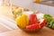 young woman preparing bell Pepper as a breakfast ingredient and ready for healthy cooking and on the table there are vegetables