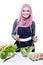 Young woman preparing making salad