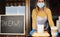 Young woman preparing takeaway food inside restaurant during coronavirus outbreak - Focus on meal