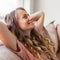 Young woman pretty relaxing on couch in living room