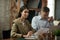 Young woman, project manager in formal wear sitting at table during business meeting in office. Team leader. Checking