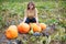 Young woman on the pumpkin patch