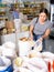 Young woman purchaser buying rice in supermarket