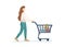 Young woman purchaser carrying supermarket shopping cart full of groceries. Female buyer pushing grocery store basket