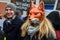 Young woman R with fox mask, participating `March for animals` in Riga, Latvia.