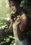 Young woman in a rain forest