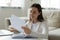 Young woman read pleasant news in paper letter