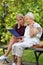 Young woman reading a book elderly woman.